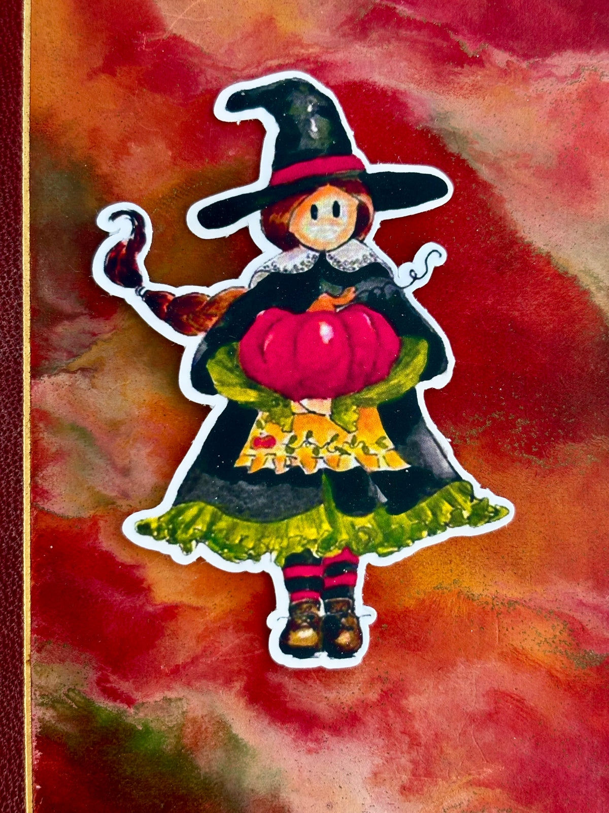 Autocollant sorcière d’automne